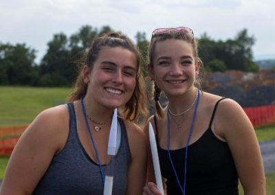 Students posing with homemade rockets