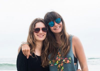 Students posing in front of the ocean