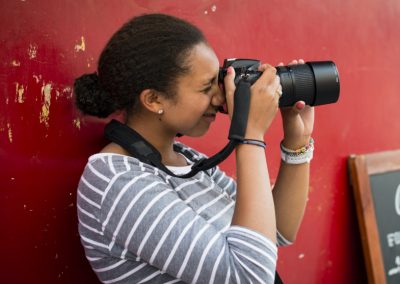 Student taking a photo with a DSLR camera