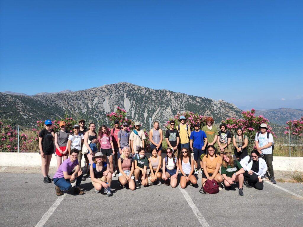 Group standing in front of a mountain.